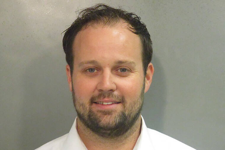 WASHINGTON COUNTY DETENTION CENTER VIA ASSOCIATED PRESS
                                This undated photo shows Josh Duggar. The former reality TV star was sentenced today to about 12 1/2 years in prison after he was convicted of receiving and possessing child pornography.