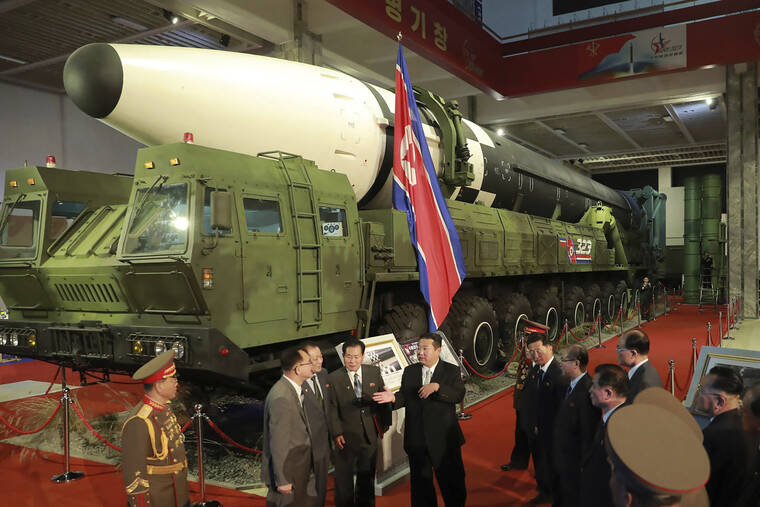 KOREA CENTRAL NEWS AGENCY / KOREA NEWS SERVICE / AP / OCT 11
                                In this photo provided by the North Korean government, North Korean leader Kim Jong Un, center, speaks in front of what the North says is an intercontinental ballistic missile displayed at an exhibition of weapons systems in Pyongyang, North Korea.