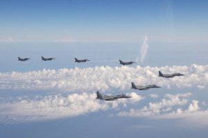 JOINT STAFF OF THE JAPANESE SELF-DEFENSE FORCE VIA AP
                                Three F-15 warplanes of the Japanese Self-Defense Force, front, and four F-16 fighters of the U.S. Armed Forces fly over the Sea of Japan on Wednesday.