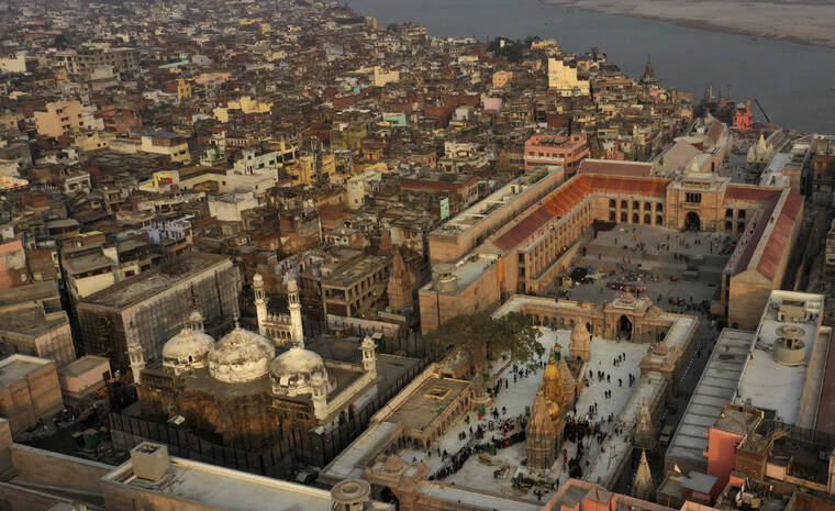 ASSOCIATED PRESS
                                An aerial view shows Gyanvapi mosque, left, and Kashiviswanath temple on the banks of the river Ganges in Varanasi, India, in 2021.