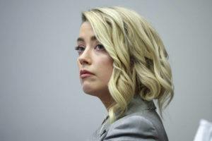 POOL PHOTO / AP
                                Actor Amber Heard appears in the courtroom in the Fairfax County Circuit Courthouse in Fairfax, Va.