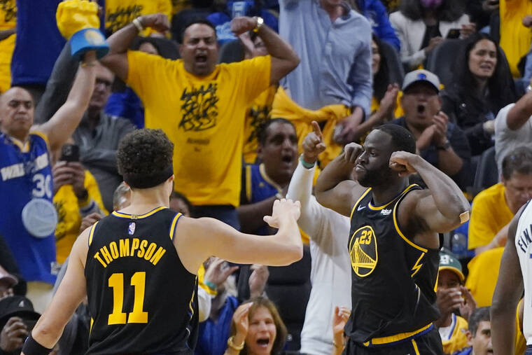 ASSOCIATED PRESS
                                Golden State Warriors forward Draymond Green celebrates next to guard Klay Thompson during the first half.
