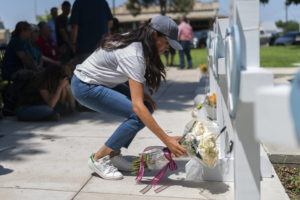 ASSOCIATED PRESS
                                Meghan Markle, Duchess of Sussex, leaves flowers at a memorial site, Thursday, May 26, for the victims killed in this week’s elementary school shooting in Uvalde, Texas.
