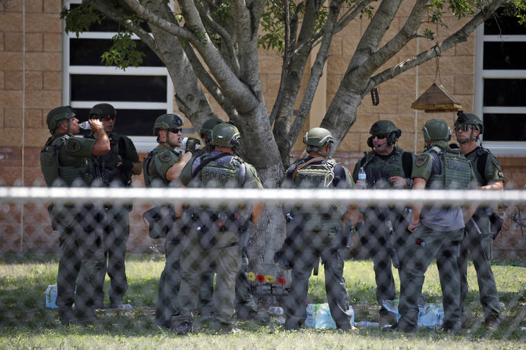ASSOCIATED PRESS / MAY 24
                                Law enforcement personnel stand outside Robb Elementary School following a shooting in Uvalde, Texas.
