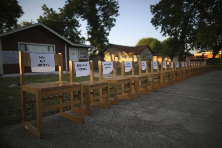 ASSOCIATED PRESS / MAY 27
                                Twenty-one empty chairs are seen outside of a daycare center as a memorial for the victims killed earlier in the week in the elementary school shooting in Uvalde, Texas.