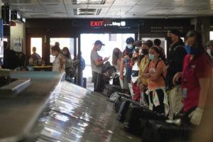 CINDY ELLEN RUSSELL / CRUSSELL@STARADVERTISER.COM
                                Travelers waited for their luggage inside of Terminal 2 at the Daniel K. Inouye International Airport.
