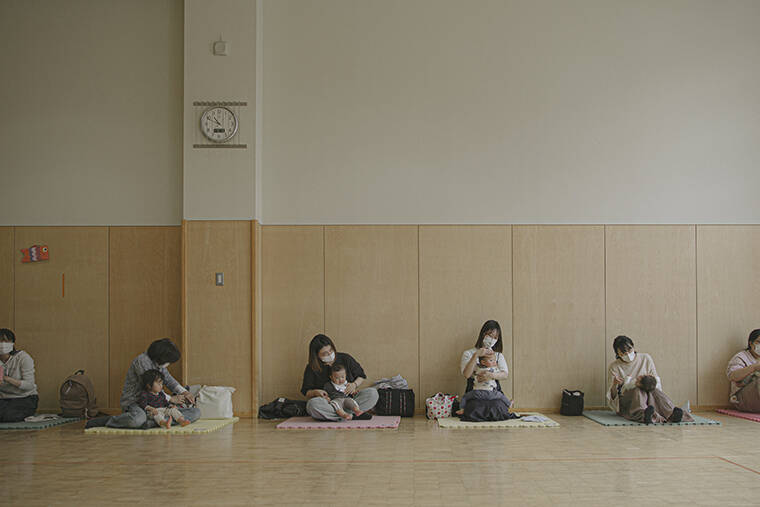 NEW YORK TIMES / APRIL 20
                                Mothers and babies attend a class at a children’s play center that is funded by central government subsidies for nuclear host towns in Kashiwazaki.