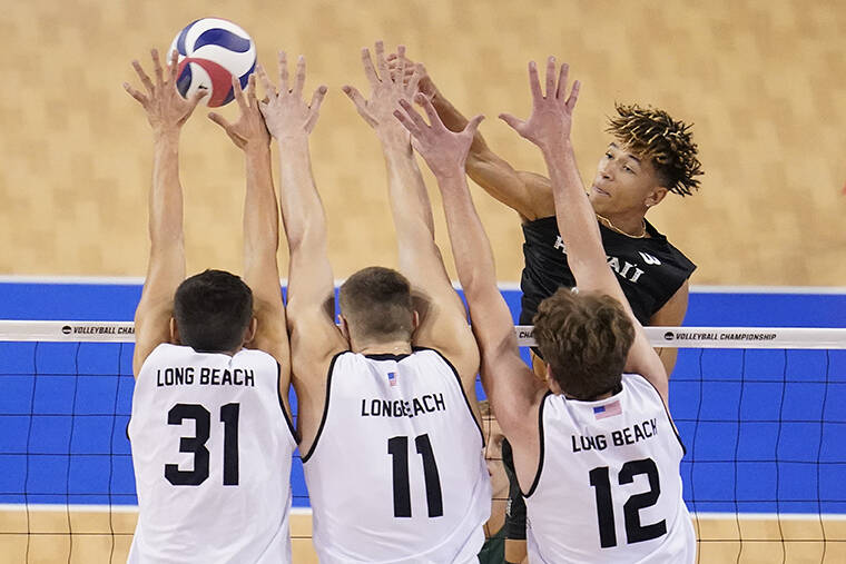 ASSOCIATED PRESS
                                Hawaii outside hitter Chaz Galloway, top right, hits over Long Beach State outside hitter Spencer Olivier (31), opposite Simon Torwie (1) and outside hitter Clarke Godbold (12) during the NCAA men’s college volleyball championship match in Los Angeles.