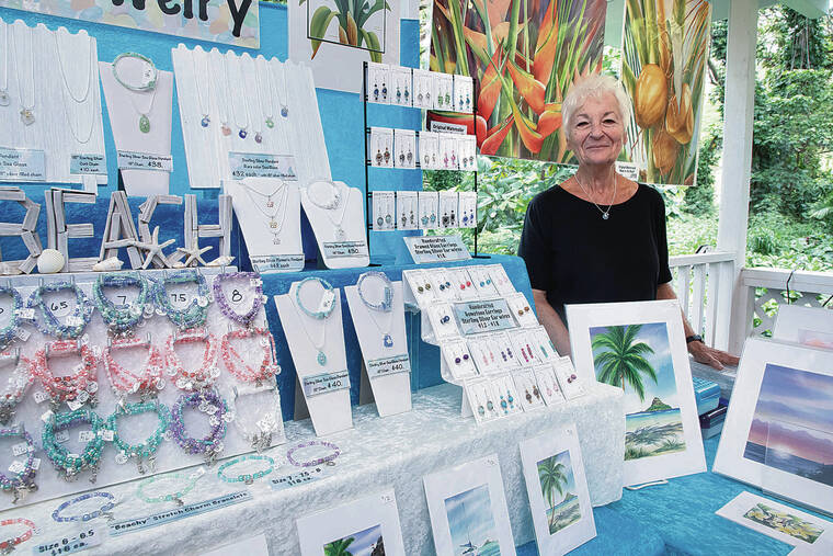 KAT WADE / SPECIAL TO THE STAR-ADVERTISER
                                Contemporary water colorist and jeweler Natalie McMahon sells her creations in the gift shop of the Tropical Farms Macadamia Nut Farm outlet in Kaneohe.