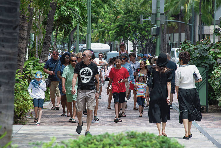 CRAIG T. KOJIMA / CKOJIMA@STARADVERTISER.COM
                                Waikiki’s Kalakaua Avenue was busy with visitors last month.