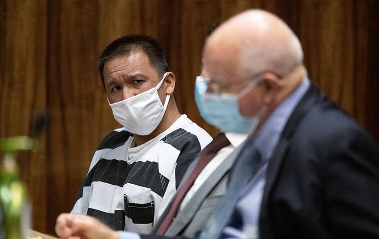 GEORGE F. LEE / GLEE@STARADVERTISER.COM
                                Eddieson Reyes turned to attorney Eric Seitz as Judge Faauuga Tootoo read the verdict finding him guilty of murder in the shooting death Triston Billimon.