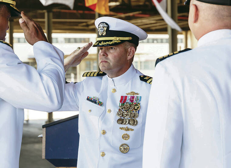 U.S. NAVY PHOTO
                                Capt. Albert Hornyak, center, saluted Rear Adm. Dion English, left, as he assumed command of NAVSUP Fleet Logistics Center Pearl Harbor in August 2021.