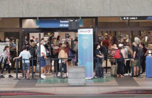 JAMM AQUINO / JAQUINO@STARADVERTISER.COM
                                Travelers waited in line outside the Hawaiian Airlines ticketing area at the Daniel K. Inouye International Airport on July 31.