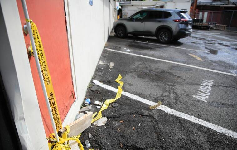 JAMM AQUINO / JAQUINO@STARADVERTISER
                                Yellow police tape was seen at an establishment at the 1600 block of Kapiolani Boulevard, today, after a shooting occurred late Wednesday.