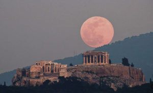ASSOCIATED PRESS / 2019
                                A supermoon near perigee, the closest point in its orbit to Earth, rises over the Parthenon on ancient Acropolis Hill in Athens, Greece.