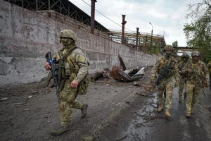 ASSOCIATED PRESS / MAY 18
                                Russian soldiers patrol a destroyed part of the Illich Iron & Steel Works Metallurgical Plant in Mariupol, in territory under the government of the Donetsk People’s Republic, eastern Ukraine. This photo was taken during a trip organized by the Russian Ministry of Defense. (AP Photo)