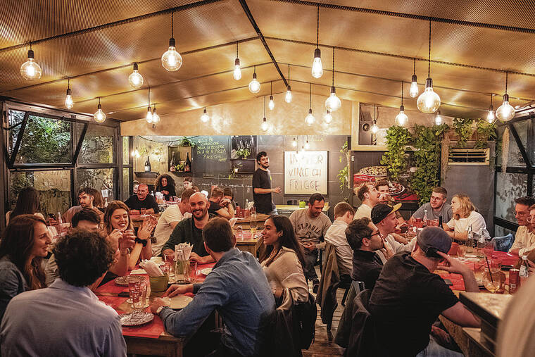 NEW YORK TIMES
                                Diners enjoy thin-crust pizzas and craft beers at the new Pizzeria L’Elementare