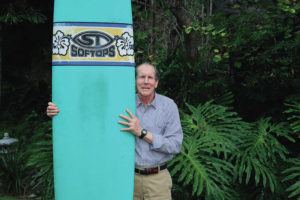 JAMM AQUINO / JAQUINO@STARADVERTISER.COM
                                Chip Hughes displays one of his soft top surfboards in Kailua.