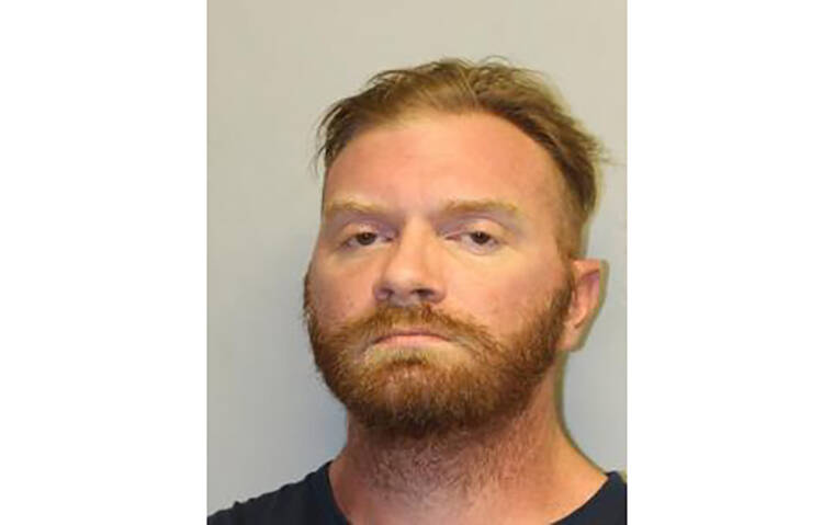 COURTESY HAWAII POLICE DEPARTMENT
                                Skyler John Fisher was taken into custody by Hawaii island police and charged with multiple drug and firearm-related offenses.