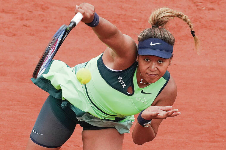 ASSOCIATED PRESS
                                Naomi Osaka of Japan served against the United States’ Amanda Anisimova on Monday during their first-round match at the French Open in Roland Garros stadium in Paris.