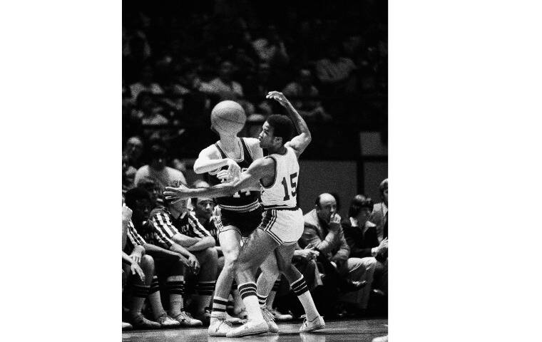 ASSOCIATED PRESS
                                University of North Carolina at Charlotte’s Bob Ball appears to get a ball full in the face as he struggles to gain possession against Kentucky’s Reggie Warford during a NIT playoff game at New York’s Madison Square Garden on March 21, 1976. Warford, Kentucky’s second Black men’s basketball player and first Black player at the school to graduate, died today.
