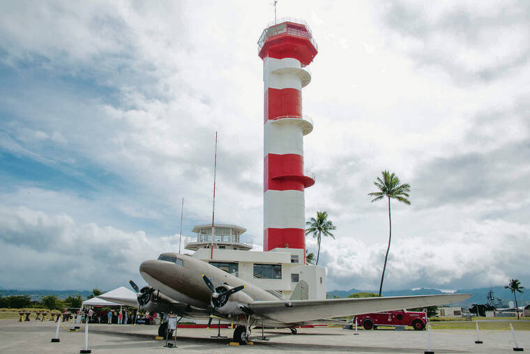 CRAIG T. KOJIMA / CKOJIMA@STARADVERTISER.COM
                                The control tower is pictured with a DC-3/C-47 at Pearl Harbor Aviation Museum.