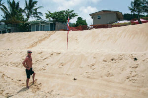 CRAIG T. KOJIMA / CKOJIMA@STARADVERTISER.COM
                                Todd Dunphy stands on the beach behind his Rocky Point homes. He faces multiple fines for moving massive amounts of sand to protect his property from beach erosion.