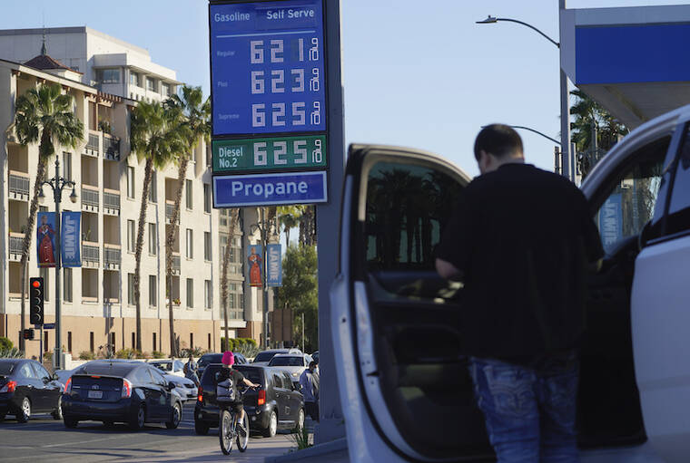 ASSOCIATED PRESS / FEB. 18
                                A motorist pauses at a gas station displaying higher gasoline prices at a Chevron station downtown Los Angeles.