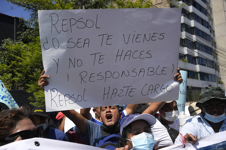 ASSOCIATED PRESS
                                Fisherman who are affected Repsol’s oil spill protest outside Spain’s embassy in Lima, Peru, on Tuesday. The sign reads in Spanish, “Repsol. So, you come and don’t take responsibility! Repsol take care of it.”