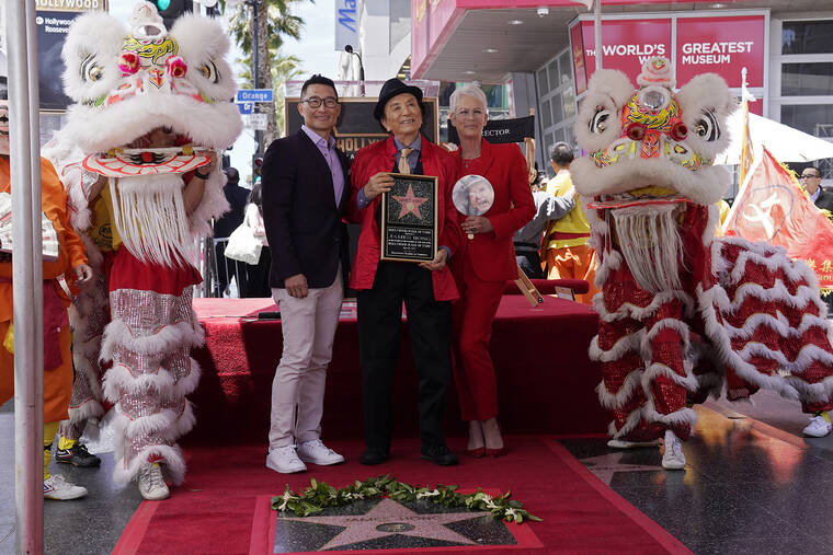 ASSOCIATED PRESS
                                Actor James Hong, center, poses with Daniel Dae Kim, left, and actress Jamie Lee Curtis as Hong was honored with a star on the Hollywood Walk of Fame during a ceremony today.