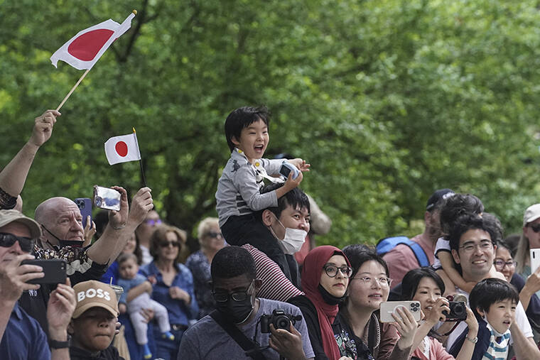 BEBETO MATTHEWS / AP
                                Paradegoers along Central Park West cheer at seeing George Takei, most famously known as Hikaru Sulu in the “Star Trek” series, as he serves as grand marshal for the first-ever Japan Parade in New York City.