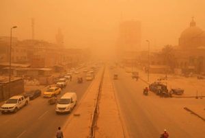 ASSOCIATED PRESS
                                People navigate a street during a sandstorm in Baghdad, Iraq, on Monday.