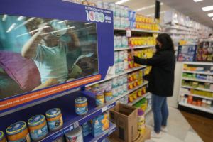 ASSOCIATED PRESS
                                A grocery store worker stocks shelves with baby formula next to a digital advertisement for a baby formula brand on Tuesday in Tijuana, Mexico. As the baby formula shortage continues in the United States, some parents are opting to cross the border into Mexico, where the shelves are still stocked with options to feed their babies.