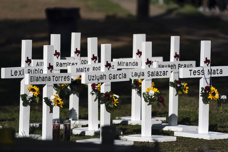 ASSOCIATED PRESS / MAY 26
                                Crosses with the names of Tuesday’s shooting victims are placed outside Robb Elementary School in Uvalde, Texas. The 18-year-old man who slaughtered 19 children and two teachers in Texas left a digital trail that hinted at what was to come.