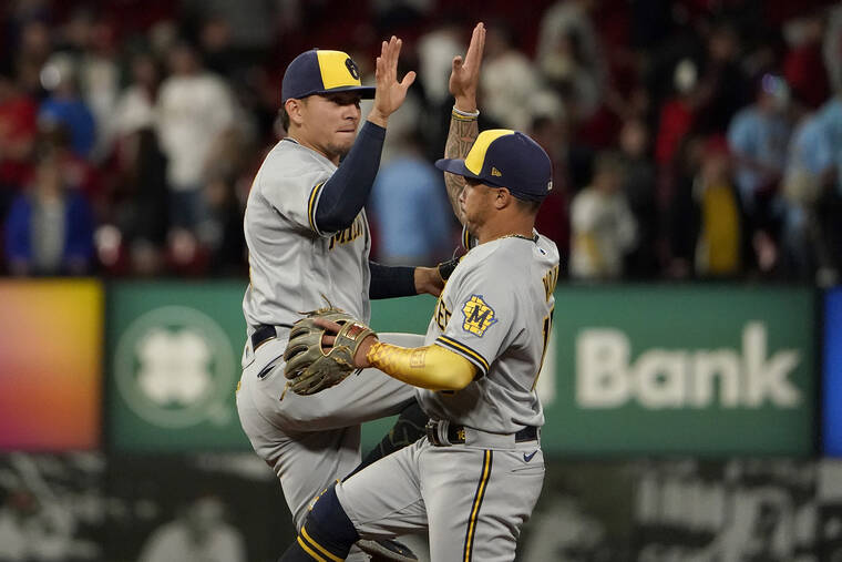 ASSOCIATED PRESS
                                The Milwaukee Brewers’ Luis Urias, left, and Kolten Wong celebrate a 4-3 victory over the St. Louis Cardinals on Thursday.