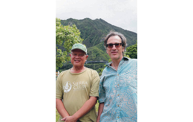 JAMM AQUINO/JAQUINO@STARADVERTISER.COM
                                Above, Randy Ching, left, board member of the Sierra Club of Hawaii, and Sean Pager, president of the Friends of Haiku Stairs, stand at the base of the Koolau Mountains in Kaneohe.