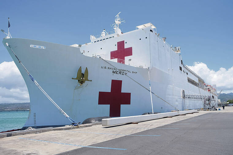 KEVIN KNODELL / KKNODELL@STARADVERTISER.COM
                                The USNS Mercy is picking up crew and supplies in preparation for its voyage across the Pacific Ocean.