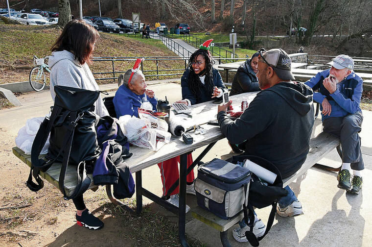 BALTIMORE SUN 
                                On nice days, Larry Griner, at top wearing the gray jacket, and his mother, Norma, venture out to Lake Roland in Baltimore County where people gather to hear her sing.