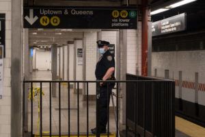 DAKOTA SANTIAGO/THE NEW YORK TIMES
                                A police officer at the Canal Street subway station in New York. A man was shot and killed on Sunday morning on a subway train in Lower Manhattan in an attack that investigators believed was unprovoked, the police said.