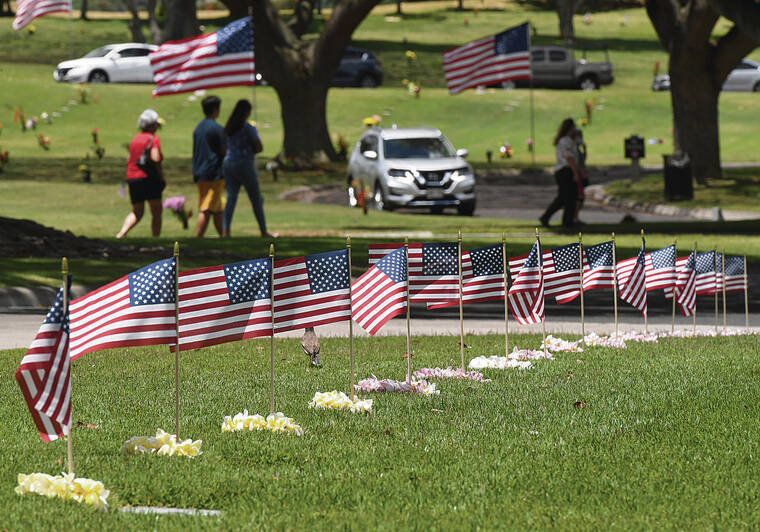 STAR-ADVERTISER / 2020
                                The city will have a lei-sewing session for Memorial Day lei May 27, 10 a.m. to 1 p.m. at Honolulu Hale. Grave markers at the National Memorial Cemetery of the Pacific are decorated with flags and plumeria lei on Memorial Day.