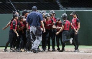 JAY METZGER / SPECIAL TO THE STAR-ADVERTISER
                                ‘Iolani’s Ailana Agbayani (1) received a hero’s welcome from her teammates after hitting a three-run home run against Mililani.