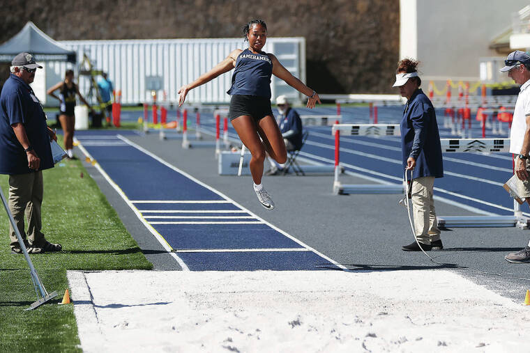 ANDREW LEE / SPECIAL TO THE STAR-ADVERTISER
                                Kamehameha’s Tatum Moku won the long jump with a mark of 18 feet.