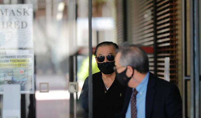 JAMM AQUINO / JAQUINO@STARADVERTISER.COM
                                Mitsunaga & Associates president and CEO Dennis Mitsunaga, left, leaves with attorney Bruce Yoshida after an initial appearance in federal court after being indicted on charges of bribery, fraud and conspiracy.