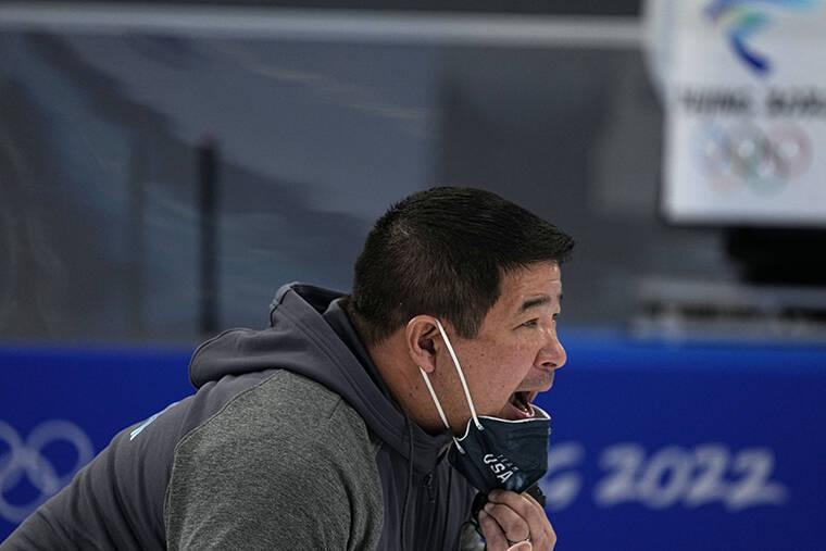 ASSOCIATED PRESS / FEB. 8
Ryan Shimabukuro, a coach for the United States speedskating team, works during the mens speedskating 1,500-meter race at the 2022 Winter Olympics in Beijing.
