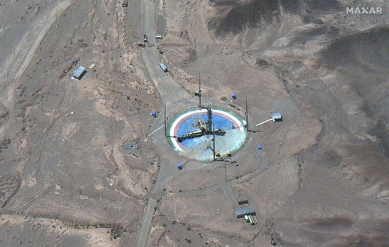 MAXAR TECHNOLOGIES / AP
                                This satellite image from Maxar Technologies shows a rocket preparing to be erected at a launch pad at Imam Khomeini Space Center southeast of Semnan, Iran on Tuesday. Iran appeared to be readying for a space launch Tuesday as satellite images showed a rocket on a rural desert launch pad, just as tensions remain high over Tehran’s nuclear program.