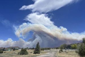 KRISSIE MAXWELL / AP
                                This Monday, June 13, photo provided by Krissie Maxwell shows smoke from a wildfire on the outskirts of Flagstaff, Ariz. swirling in the air.