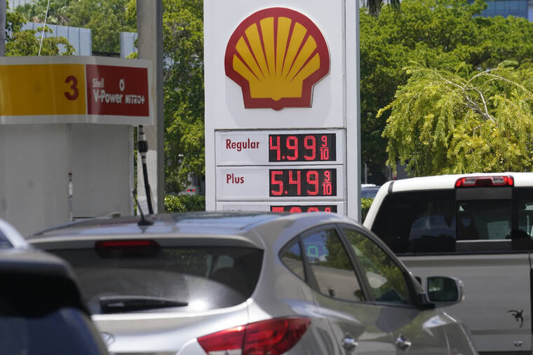 ASSOCIATED PRESS / JUNE 17
                                Car line up at a Shell gas station in Miami.