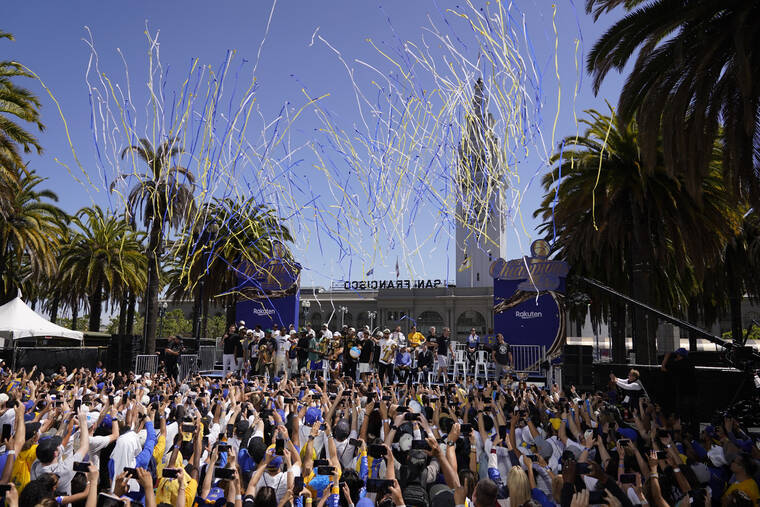 ASSOCIATED PRESS
                                The Golden State Warriors pose for a group photo before the start of their NBA championship parade in San Francisco.