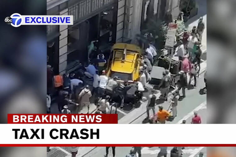 WABC-TV VIA AP
                                Bystanders move in to assist pedestrians who were struck by a cab that jumped a curb in New York. A taxi cab turning onto a narrow section of Broadway hit a bicyclist, then swerved onto a Manhattan sidewalk and into a group of pedestrians Monday afternoon, critically injuring three people, police said.
