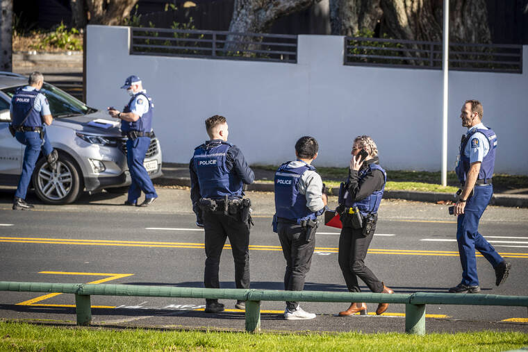 NEW ZEALAND HERALD VIA AP
                                Police set up cordons and search area around a suburb of Auckland following reports of multiple stabbings, in New Zealand, Thursday.